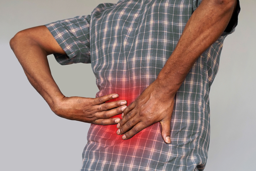Man with back pain from kidney stones.