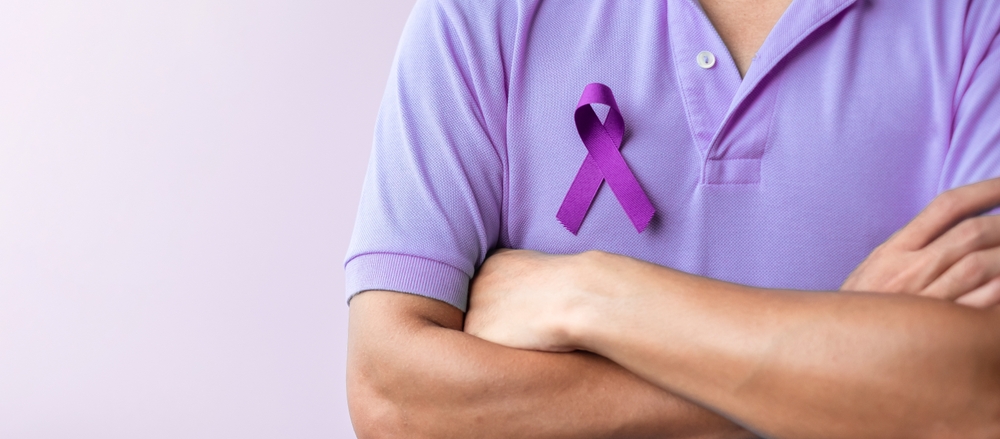 Man wearing testicular cancer awareness ribbon.
